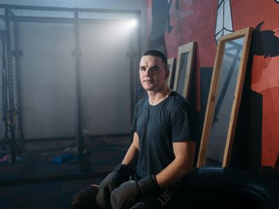 Athletic man silhouette in a modern training space